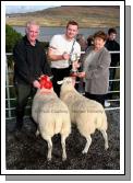 Maureen Johnston, Westport/Cloughmore presents the Thomas Johnston Cup to John and Edward Fadian, Dookinella  for best pen of 2 Crossbred Ewes (Open) at the 21st Achill Sheep Show (Taispentas Caorach Acla 2007) at Pattens Bar, Derreens Achill. Photo:  Michael Donnelly