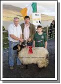 Sean Graven, Currane Achill, winner of the Hogget Ram (Open) class at the 21st Achill Sheep Show (Taispentas Caorach Acla 2007) at Pattens Bar Derreens Achill is presented with the Mary Ellen Grealis Memorial Cup by Noel Grealis, included in photo is Seamus Tiernan. Photo:  Michael Donnelly