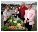 Desmond McLoughlin, Ballyfarna, Claremorris is presented with the Michael Nevin Cup by Mary McTigue  Claremorris Show Committee, for Best selection of Vegetables from the garden at the 88th Claremorris Agricultural Show, included in photo are Michael and Evelyn McLoughlin. Photo:  Michael Donnelly   