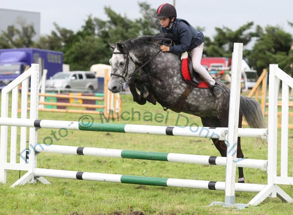 Cormac Hanley Jnr, Claremorris, on Emerald Pride clears the final jump to win the 138 ABC  Claremorris Show Jumping section at Claremorris Agricultural Show. Photo: © Michael Donnelly