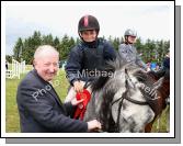 Cormac Hanley on Emerald Pride winner of the 138 ABC is presented with his rosette by Bernie McKenna Castlebar at Claremorris Agricultural Show.Photo:  Michael Donnelly