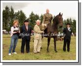 Cormac Hanley (sponsor) presents the Oliver Dixon Gold Cup to David McCormack, Mullingar, for Champion Hunter under Saddle at Claremorris Agricultural Show, included in photo are Claire Byrne (Show committee) and judges James McWeeney, Leitrim and  James Murphy, Swinford. Photo: Michael Donnelly.