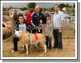 Eoin Prendergast and Ger McLoughlin presenting the McLoughlin Perpetual Trophy  for Champion Sheep of Claremorris Show to Liam and David (on left) Coen, Hollymount. Photo: Michael Donnelly.