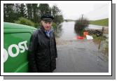 Floods Stopping Postman Sean Joyce at Ballinacarra, Kilmaine from accessing his neighbours, and some of the local farmers are forced to make a 15 mile mile trip to feed thier animals. Photo:  Michael Donnelly