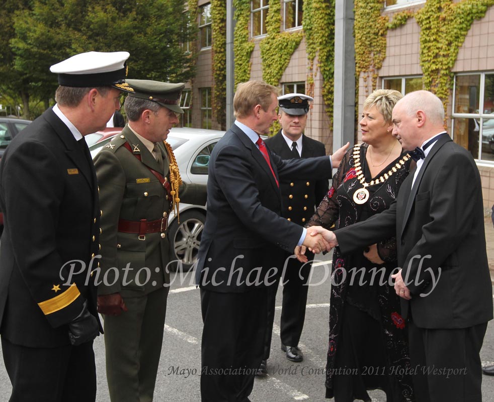 Taoiseach Enda Kenny TD, is welcomed to the Mayo Association Worldwide Convention 2011 at Hotel Westport, Westport Co Mayo by Cllr Tereasa McGuire Mayor of Westport and Peter Hynes, County Manager Mayo Co Co, included in photo are L-R Commodore Mark Mellett and  Comdt Michael Treacy, Taoiseach's aide-de-camp;  . Photo:Michael Donnelly