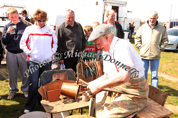 Terry Maughan, Ballyhaunis puts the finishing touches to a copper bucket at the 2009 Mayo County Ploughing Championships at Claremorris. Photo:  Michael Donnelly