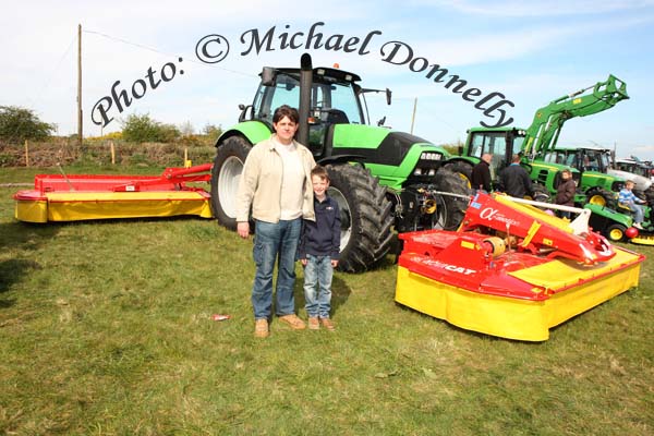 Gerry and Patrick Rabbitte of Gerry Rabbitte Agri Sales pictured with a machine that would make quick work of a few acres of Grass at the 2009 Mayo County Ploughing Championships at Claremorris. Photo:  Michael Donnelly