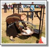 Delia Lyons, Ballyhaunis about to bake a cake on the open fire at the 2009 Mayo County Ploughing Championships at Claremorris. Photo:  Michael Donnelly