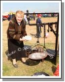 Delia Lyons, Ballyhaunis about to bake a cake on the open fire at the 2009 Mayo County Ploughing Championships at Claremorris. Photo:  Michael Donnelly