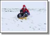 Children in Ballyheane enjoying a slide after the snow fall on Friday last. Photo:  Michael Donnelly