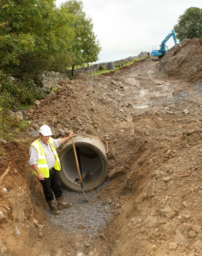 Gerard McGough pictured  as the last few of the 3ft Daimeter by 8ft long pipes are laid to relieve flooding from the Thomastown Turlough Kilmaine. Photo:  Michael Donnelly