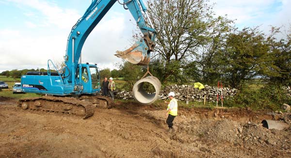 One of the last few 3ft Daimeter by 8ft long pipes are laid to relieve flooding from the Thomastown Turlough Kilmaine. Photo:  Michael Donnelly