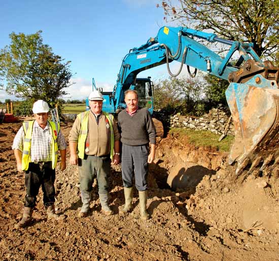 Gerard McGough and Mick Butler pictured with Sean Joyce Kilmaine (who has fought a campaign for many years to get a solution to the local flooding) as the last few pipes are backfilled to relieve the winter flooding from the Thomastown Turlough Kilmaine. Photo:  Michael Donnelly