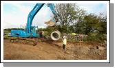 One of the last few 3ft Daimeter by 8ft long pipes are laid to relieve flooding from the Thomastown Turlough Kilmaine. Photo:  Michael Donnelly