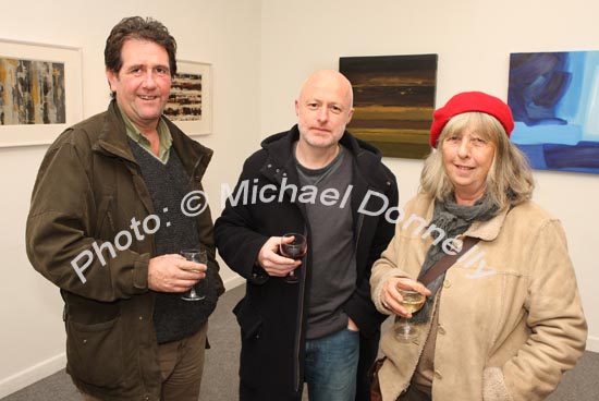 Pictured at the official opening of "Intimate Ground" an exhibition of atmospheric paintings by artist Stephen Rinn, in the Linenhall Arts Centre Castlebar, from left: Dermot Seymour Partry; Ned McLoughlin Inchicore, Dublin and Audrey Carr Westport. Photo:  Michael Donnelly .
