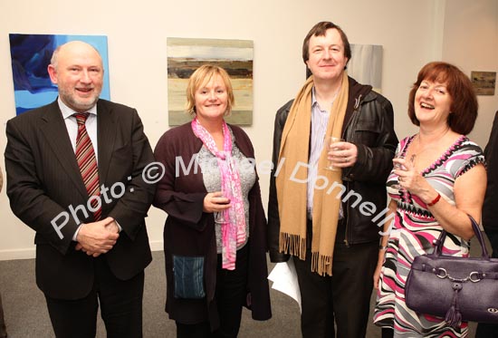 Pictured at the official opening of "Intimate Ground", an exhibition of atmospheric paintings by artist Stephen Rinn, in the Linenhall Arts Centre Castlebar, from left: Cllr Michael Kilcoyne, Castlebar; Anna O'Mahony, Cork, Kieran Smyth, Dublin; and Margaret McDonnell, Carlingford Co Louth. Photo:  Michael Donnelly