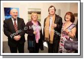 Pictured at the official opening of "Intimate Ground", an exhibition of atmospheric paintings by artist Stephen Rinn, in the Linenhall Arts Centre Castlebar, from left: Cllr Michael Kilcoyne, Castlebar; Anna O'Mahony, Cork, Kieran Smyth, Dublin; and Margaret McDonnell, Carlingford Co Louth. Photo:  Michael Donnelly