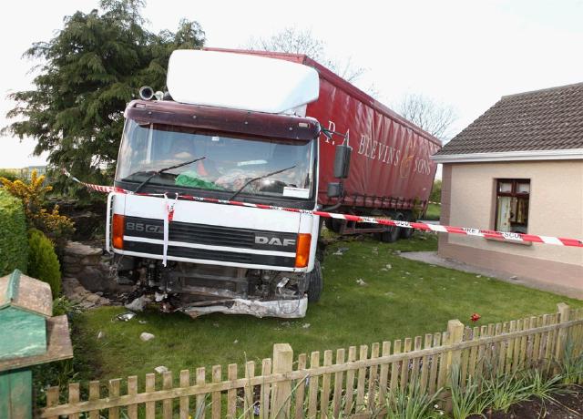 The truck crashed through a wall in Ballyheane and ended up in a fishpond after the driver took ill.