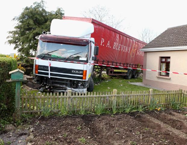 The truck crashed through a wall in Ballyheane and ended up in a fishpond after the driver took ill. It narrowly missed the house.