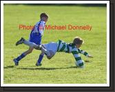 Colm Nevin in acrobatic pose in the U-12 Boys Soccer final against Lucan Dublin at the HSE Community Games National Finals in Mosney, Photo:  Michael Donnelly