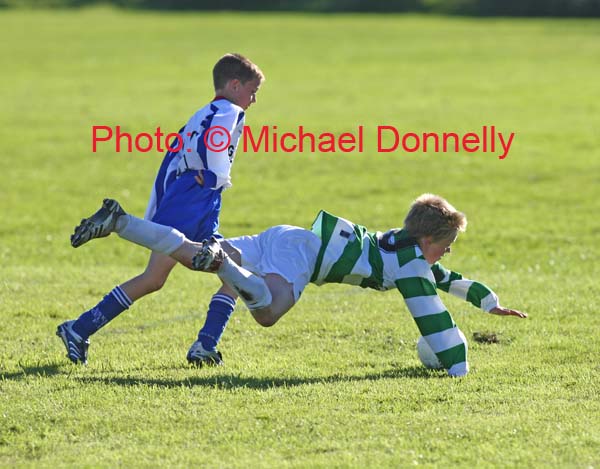 Colm Nevin in acrobatic pose in the U-12 Boys Soccer final against Lucan Dublin at the HSE Community Games National Finals in Mosney, Photo:  Michael Donnelly