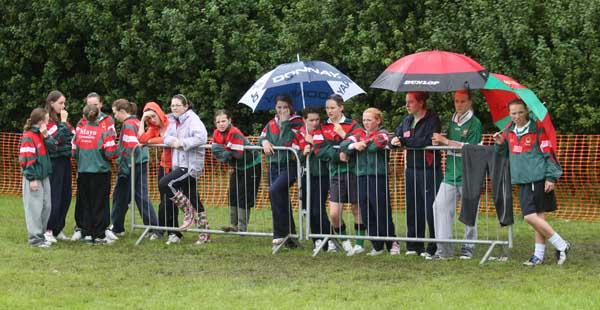 Watching the Castlebar Girls rounders during the damp weather on Saturday at the HSE Community Games National Finals in Mosney. Photo:  Michael Donnelly