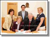 Bridie McHale, Castlebar, proposer for Independent General Election Candidate Dr Jerry Cowley, signs the nomination papers in the Court House Castlebar pictured with Returning Officer Fintan Murphy and at back from left: Marie Quinn, Assistant Returning Officer, Dr Jerry Cowley and Teresa Cowley. Photo:  Michael Donnelly