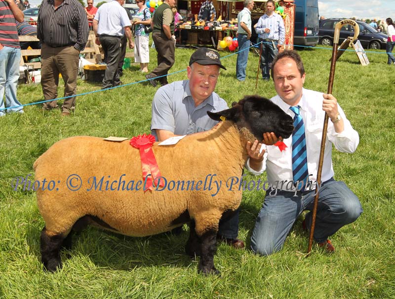 James Rooney, Grange Co Sligo pictured  with his prizewinning aged Ewe in the West of Ireland Registered Pedigree Suffolk Sheepbreeders Club Class at Roundfort Agricultural Show with Martin Butler, Judge, Co Meath. Photo: © Michael Donnelly Photography