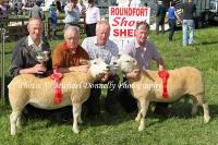 Tom Waldron, Tuam (Judge)  presents the cup to Aidan Fahy , Carownamona, Ardrahan, Co Galway, for his prizewinning pair of  Ewes Hoggetts, Overall Commercial Champions at Roundfort Agricultural Show, included in photo are Noel Costello, Committe and John Farrell (handler).  Photo: © Michael Donnelly Photography