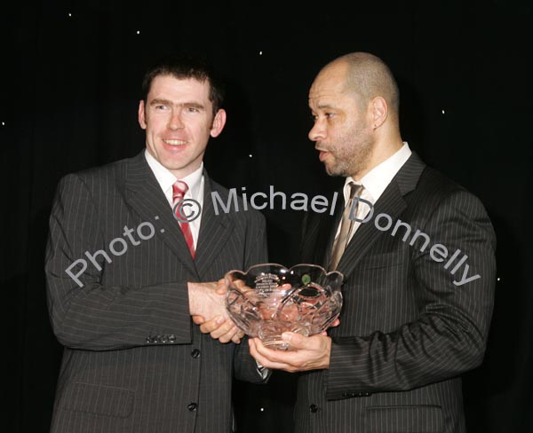 Tom Prendergast accepts the Hall of Fame award on behalf of his uncle Paddy Prendergast from Guest of Honour Paul McGrath at the Western People Mayo Sports Awards 2006 presentation in the TF Royal Theatre Castlebar. Photo:  Michael Donnelly