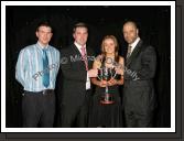 Aoife Herbert winner of the Ivan Neill "Young Sports Star of the Year" award is presented with the cup by Ivan's nephew Reuben and Guest of Honour Paul McGrath at the Western People Mayo Sports Awards 2006 presentation in the TF Royal Theatre Castlebar. Included in photo on left is Anthony Hennigan, Sports Editor of the Western People. Photo:  Michael Donnelly