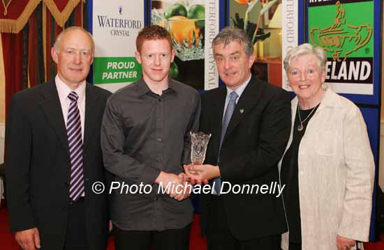 Aaron Crawford, Strabane Track Club is presented with his award at the Waterford Crystal A.A.I,  Juvenile Star Awards in the Belmont Hotel, Knock Co Mayo  by  Patsy McGonagle Vice-president AAI included in photo are Michael Gaffney, Waterford Crystal (sponsor), and Breda Synott chairperson National Juvenile Committee AAI, Photo Michael Donnelly

