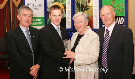 Des Earls, of Inbhear Dee Athletic Club, is presented with his award at the Waterford Crystal A.A.I,  Junenile Star Awards in the Belmont Hotel Knock by  Brenda Synott chairperson National Juvenile Committee AAI, included in photo are Patsy McMonagle Vice-president AAI and Michael Gaffney Waterford Crystal (sponsors). Photo Michael Donnelly