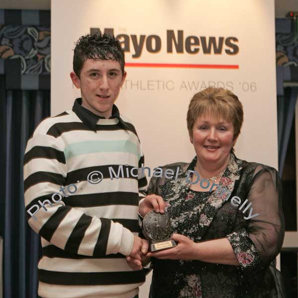 Juvenile Male Cross Country winner Daniel Murray of Ballina AC received his award from Marion Mattimoe PRO Mayo Athletics Board