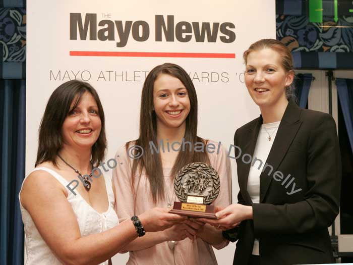 Overall Athlete of the year Pamela Hughes of Westport AC is presented with the main award of the night at the Mayo News Mayo Athletic awards by Marie O'Malley Mayo Athletics Board and Denis Horan Editor Mayo News. Photo:  Michael Donnelly