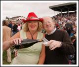 Mary Maguire Claremorris pours a glass of Champagne for Paul Claffey after Mayo defeated Laois which was shown on the Big Screen at the  "Craic on the Track" at Ballinrobe Racecourse.  Photo: Michael Donnelly.