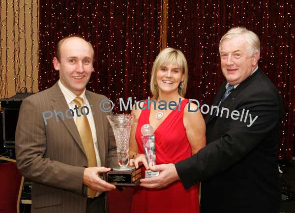Donal O'Gallachoir chairman Breaffy GAA Club (on right) presents the Breaffy GAA Clubman of the year award to Sean Grealis at the Breaffy GAA Annual Dinner Dance in Breaffy House Hotel, Castlebar. Included in photo is Mary Grealis. Photo:  Michael Donnelly