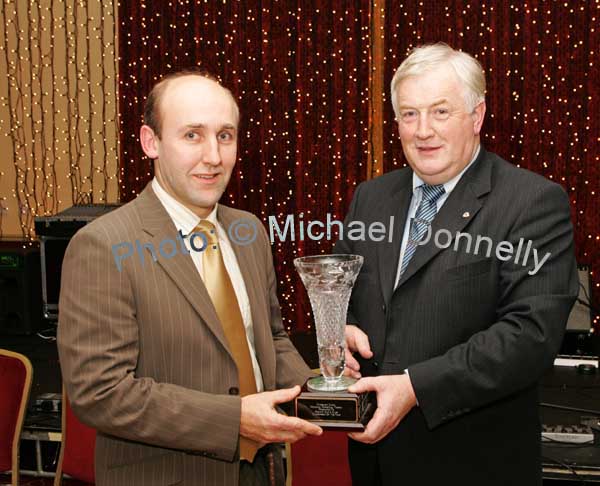 Sean Grealis is  presented with the Margaret Canny Memorial Trophy for Breaffy GAA Clubman of the Year by Donal O'Gallachoir Club chairman at the Breaffy GAA Annual Dinner Dance in Breaffy House Hotel, Castlebar. Photo:  Michael Donnelly