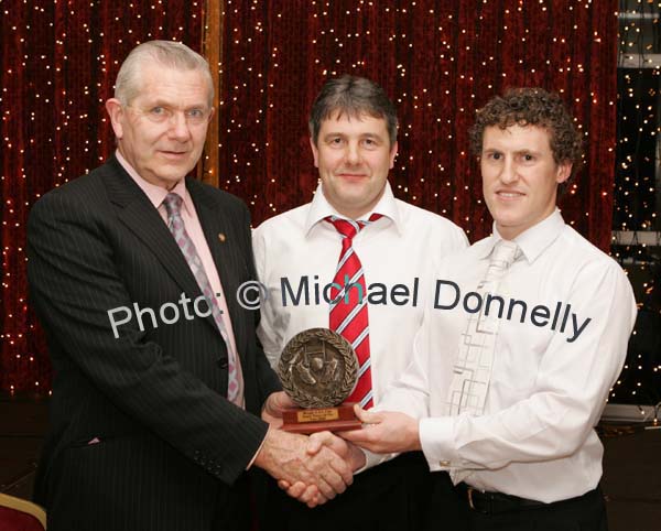 J.P. Lambe Treasurer Mayo GAA County Board presents the Breaffy GAA Club Senior Player of the year award to Kevin Scahill at the Breaffy GAA Annual Dinner Dance in Breaffy House Hotel, Castlebar. Included in photo is Breaffy Senior manager John Fahey. Photo:  Michael Donnelly