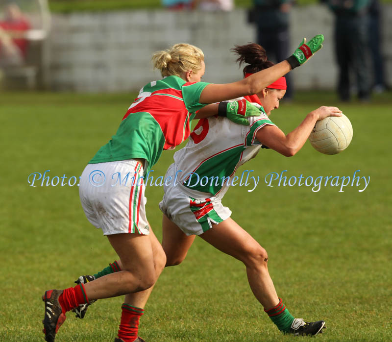 Carnacon's Aoife Loftus adn Claire Grehan St Brigids in action in the Tesco Connacht Ladies Gaelic Senior Club Championship final in Canon Gibbons Park Claremorris. Photo: © Michael Donnelly Photography