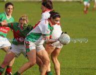 Michelle Walsh  of St Bridgids Kiltoom, gets by as her team mate Fiona Gavin blocks the vision of Carnacon captain Fiona McHale in the Tesco Connacht Ladies Gaelic Football  Senior Club Championship final in Canon Gibbons Park Claremorris. Photo: © Michael Donnelly Photography