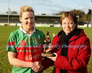 Carnacon captain Fiona McHale is presented with the Player of the Match  award by Kathleen Kane, President Ladies GAA Connacht Council at the Tesco Connacht Ladies Gaelic Football Senior Club Championship final in Canon Gibbons Park Claremorris. Photo: © Michael Donnelly Photography