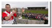 Liam Walsh captain Aughamore with the Pete McDonnell Memorial Cup and supporters after they defeated Ballina Stephenites B in the Breaffy House and Spa  County Junior  Football Final in McHale Park Castlebar. Photo: Michael Donnelly