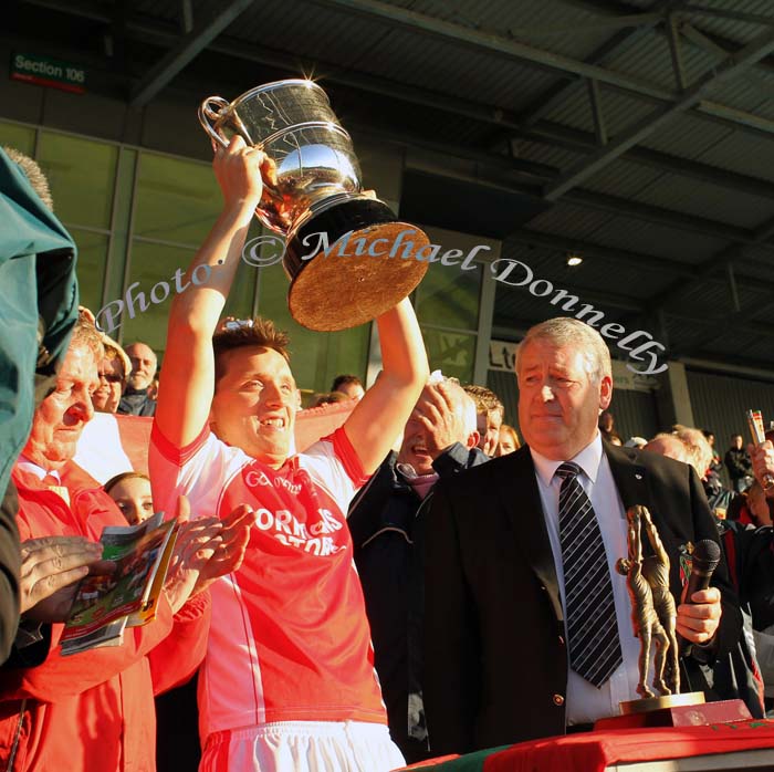 John Feeney captain Ballintubber raises the Moclair Cup after defeating Castlebar Mitchels in the TF Royal Hotel and Theatre Mayo Senior Football Championship final in McHale Park. Photo:Michael Donnelly,