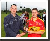 Daire Conway Castlebar  Mitchels is presented with the Man of the Match award in the Ulster Bank U-21A County Football Championship final in Fr O'Hara Park Charlestown by Michael Boland, Ulster Bank Ballina, after defeating Crossmolina Deel Rovers. Photo:  Michael Donnelly