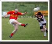 Enda Murphy sets  up an attack for Castlebar Mitchels, despite the attention of Crossmolina's Mark Leonard in the Ulster Bank U-21A County Football Championship final in Fr O'Hara Park Charlestown. Photo:  Michael Donnelly