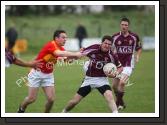 Mark Leonard, Crossmolina Deel Rovers  tries to get free from Castlebar Mitchels' Alan Joyce
 in the Ulster Bank U-21A County Football Championship final in Fr O'Hara Park Charlestown. Photo:  Michael Donnelly