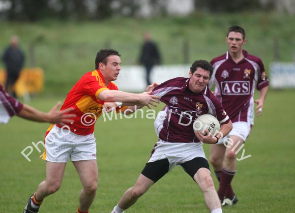 Mark Leonard, Crossmolina Deel Rovers  tries to get free from Castlebar Mitchels' Alan Joyce
 in the Ulster Bank U-21A County Football Championship final in Fr O'Hara Park Charlestown. Photo:  Michael Donnelly