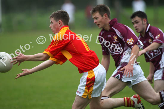 Neil Douglas, Castlebar Mitchels. gets the ball away, as Crossmolina apply pressure in the Ulster Bank U-21A County Football Championship final in Fr O'Hara Park Charlestown. Photo:  Michael Donnelly