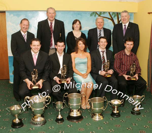 Shona Hegarty (front centre) representing Darragh Quinn Chemists, Crossmolina sponsors of the service awards which were presented to Crossmolina players who had played in 50 or more Championship matches for Crossmolina, at the Club's Dinner Dance in the Upper Deck Crossmolina, from left:  Liam Moffatt, Joe Keane, Peadar Gardiner and Noel Convey; At back; Deputy John Carty, T.D.; Cathal Prior, Club Chairman; Ann Heffernan, Club Lady of the Year; Billy Fitzpatrick, Special Guest (Mid West Radio), and James Waldron, Chairman Mayo GAA County Board. Photo:  Michael Donnelly